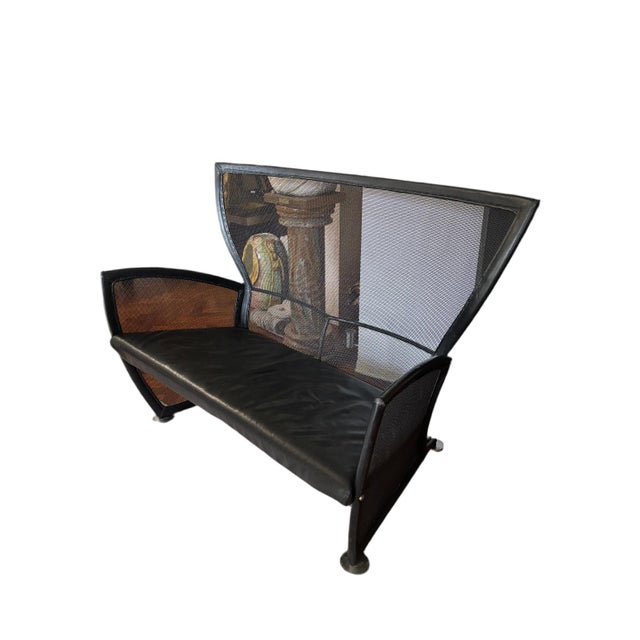 Privè model sofa, created by Paolo Nava in the 70s. It has a modern and industrial design, characterized by a black metal...