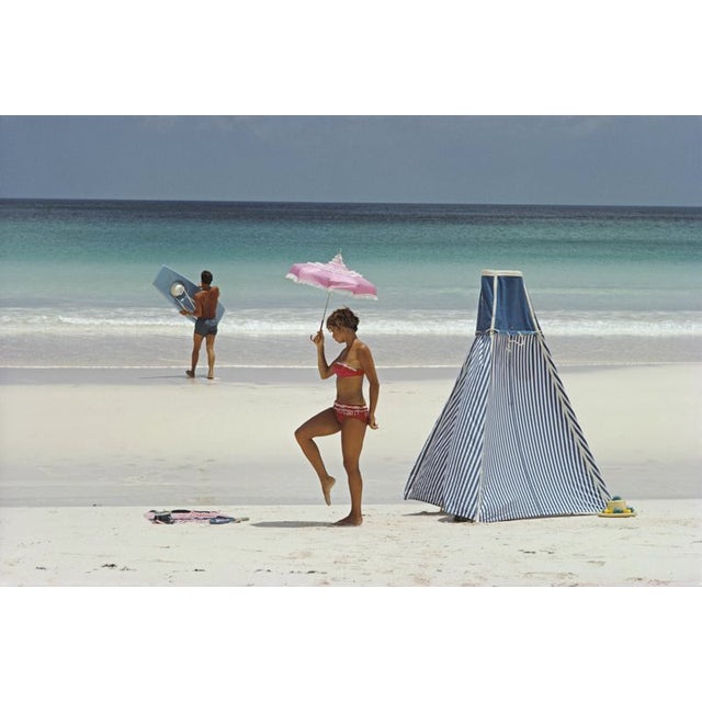 Harbour Island, Bahamas 1967 A couple relax at the beach on Harbour Island, Bahamas, 1967. Photo by Slim Aarons Slim...