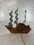 Vintage wood and metal sailing ship with electric clock.