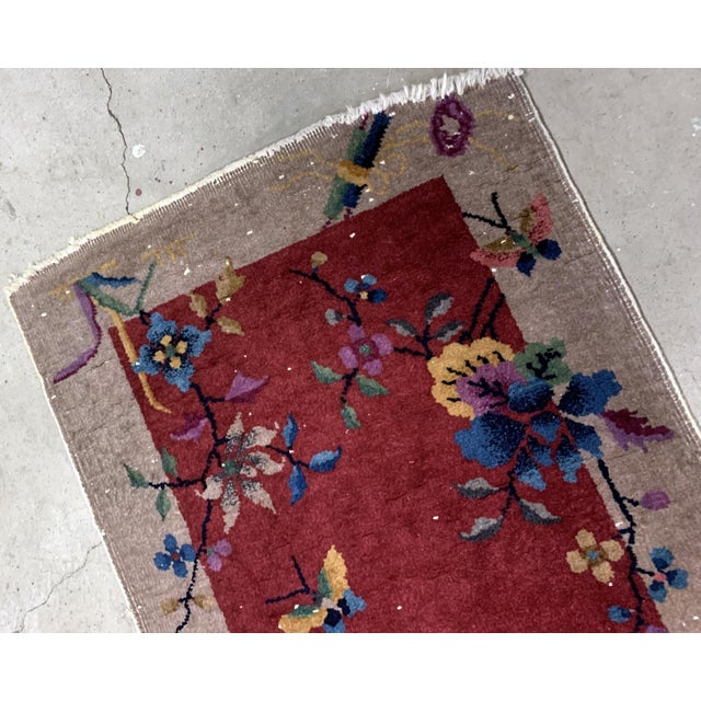 Handmade antique Art Deco Chinese rug in red shade. The rug is from the beginning of 20th century in original condition,...