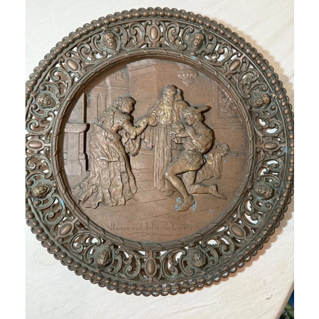 The large antique ornate bronze patinated metal relief wall plaque featuring "Romeo and Julia for Lorenzo" is a unique and...