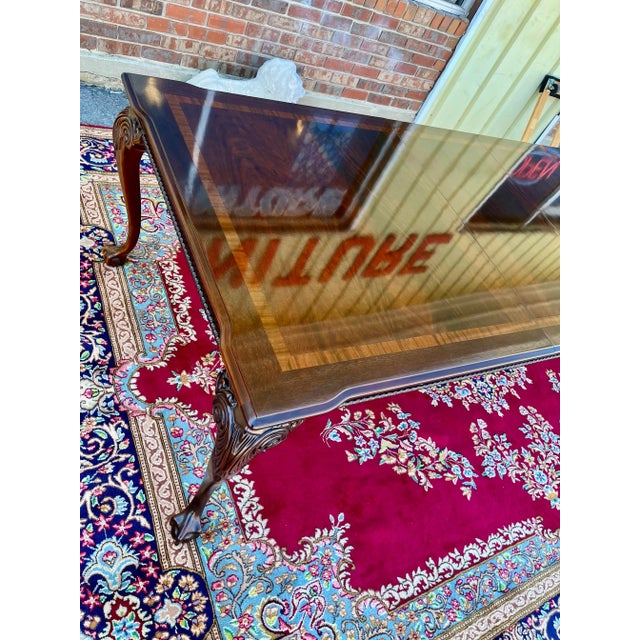 Beautiful Chippendale style dining table by Thomasville. Features a high gloss banded, flame mahogany top, beaded apron...