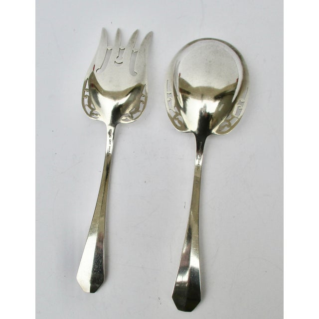 Reed & Barton sterling silver salad set circa 1910. Pattern Dominick Queen Anne. Large and boldly designed with cutout...