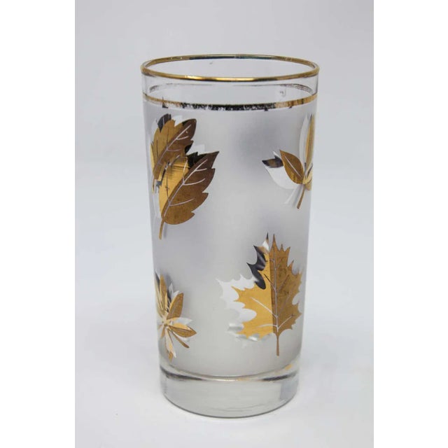 Set of four vintage cocktail glasses. Manufactured by Libbey, 1950s Hollywood Regency. Decorated with a classical gold...