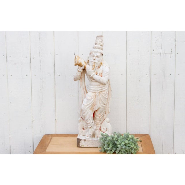 An antique finely carved statue from southern India that was originally part of an exterior wall of a temple. This antique...