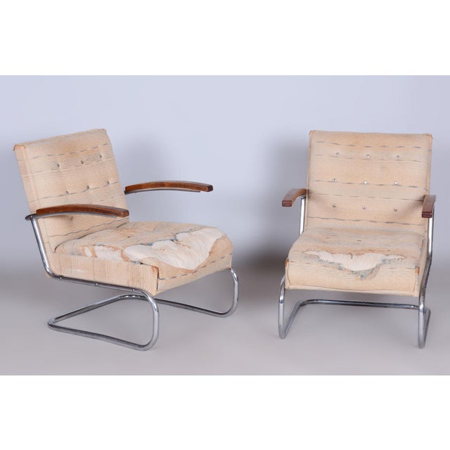 An atypical, rarely seen model of armchairs and a stool in original, well-preserved condition. Dimensions of the armchair:...
