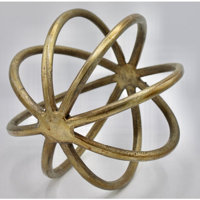 A stunning vintage golden orb. This golden orb would look excellent in a modern or mid century modern style of home. It...