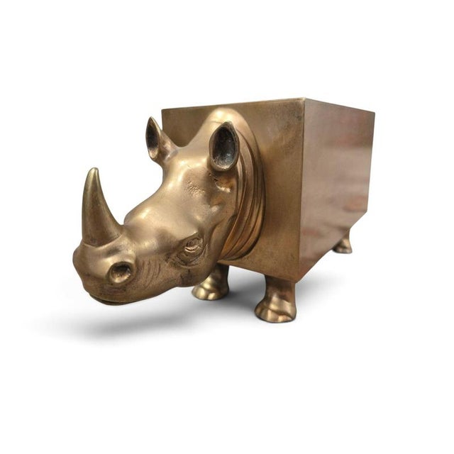 A striking and highly decorative sculptural double bottle holder in the form of a stylized rhinoceros, produced in France...
