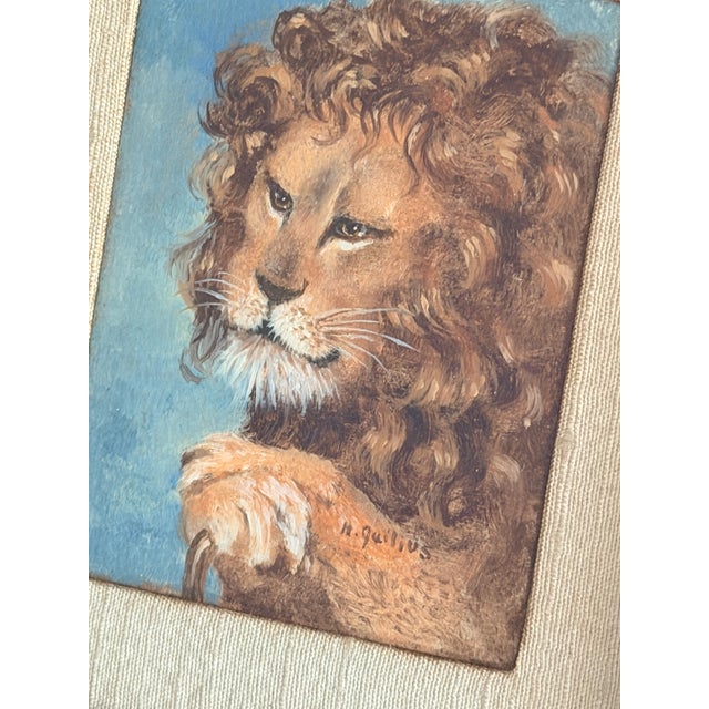 A charming and finely executed 19th century lion portrait miniature, rendered in oil on canvas and presented within a...