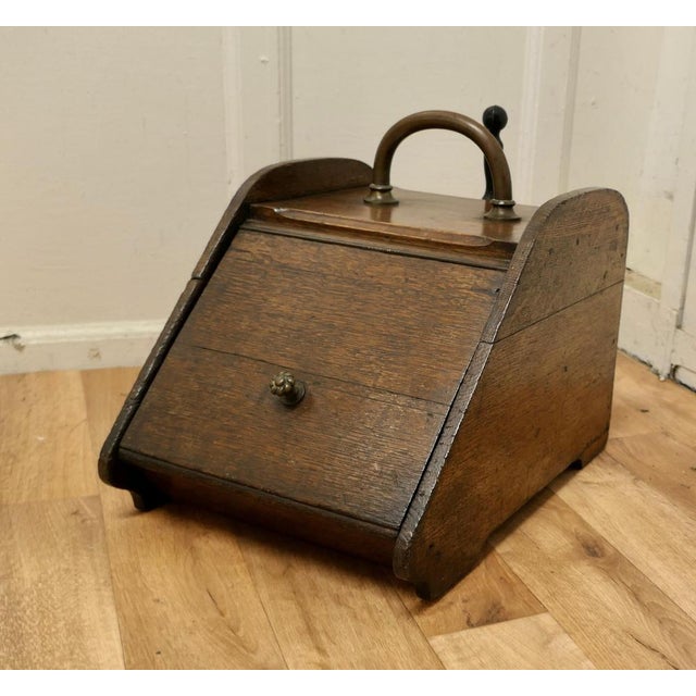 Chunky Victorian oak coal box with liner and shovel. A charming piece of useful Victorian furniture. The Purdonium has...