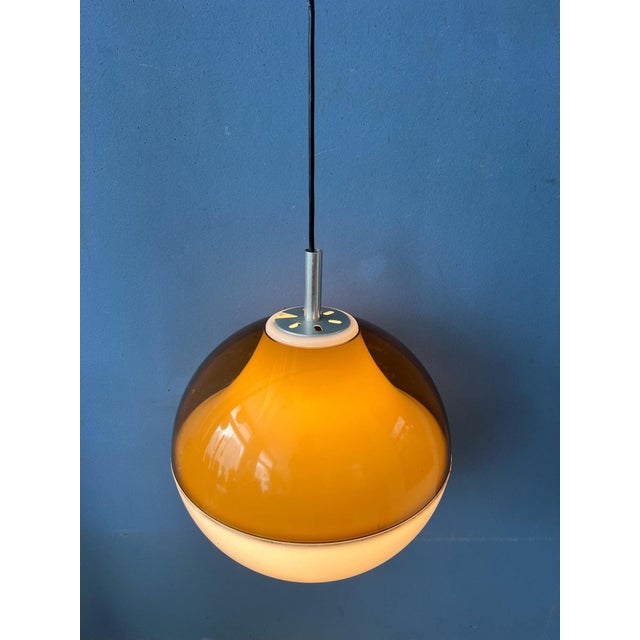 Acrylic glass acrylic glass 'globe' pendant lamp. The upper half of the globe has an inner and outer shade. There is a...