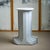 White marble column in a stepped design with a round base. Carlo Scarpa designed this series in 1970 for the Italian...