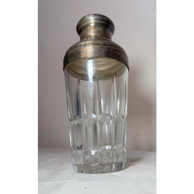 This vintage handmade Saint Louis cut crystal silver plate cocktail drink shaker is a luxurious addition to any barware...