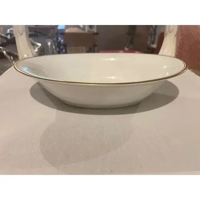 Offered is a vintage serving bowl by Noritake Bradford #5182. Timeless off-white China with gold rim.