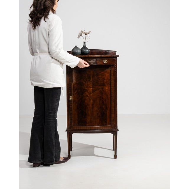 This piece presents as a side cabinet, distinguished by dark mahogany, single door, open showing shelf. Dating to 19th...