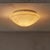 An Italian flush mount from the 1970s, crafted in hand-blown Murano glass with soft gray and rose tones swirling through...