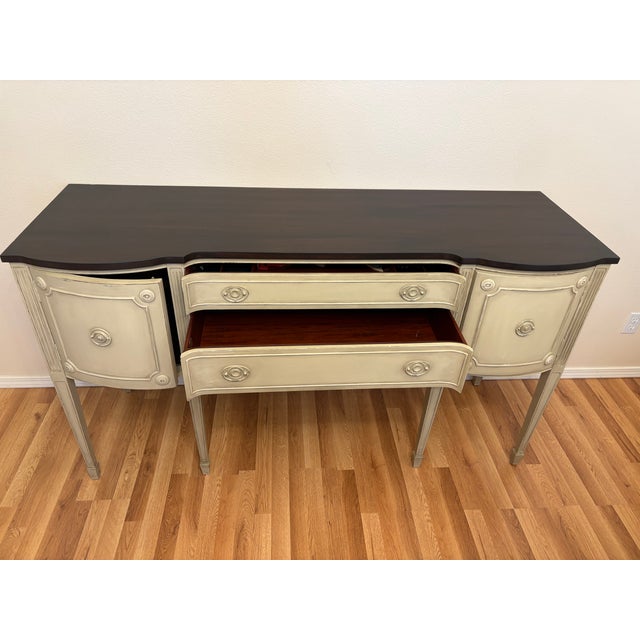 This sideboard, buffet or cradenza was refurbiished by a very talented artist several years before I purchased it and I...