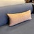 Design Plus Gallery presents a Custom Lumbar Pillow. This elongated pillow has a woven textile front in muted rust, sand,...