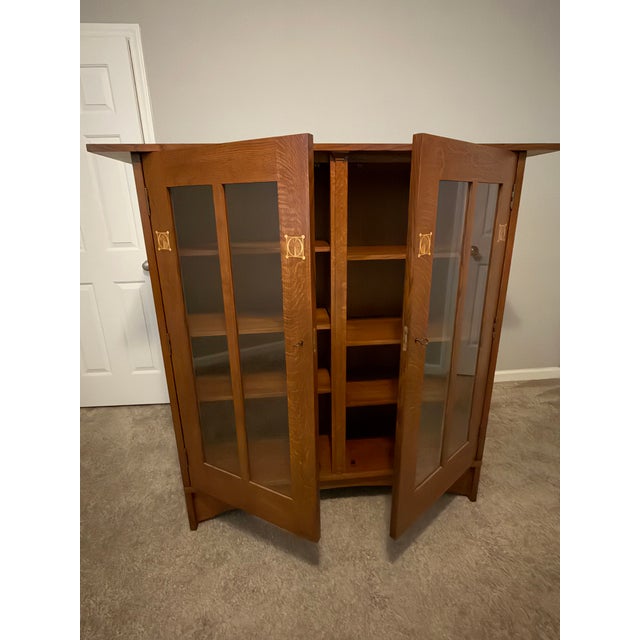 Authentic Mission-style oak bookcase by Stickley, inspired by the designs of Harvey Ellis. The standout feature of this...