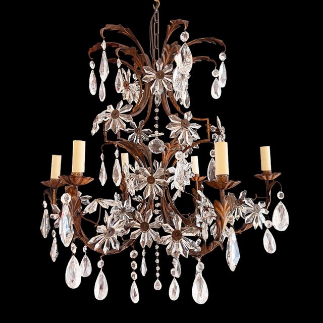 A really impressive ornate chandelier, made in France in the early 1920s. The chandelier has a vintage, romantic design....