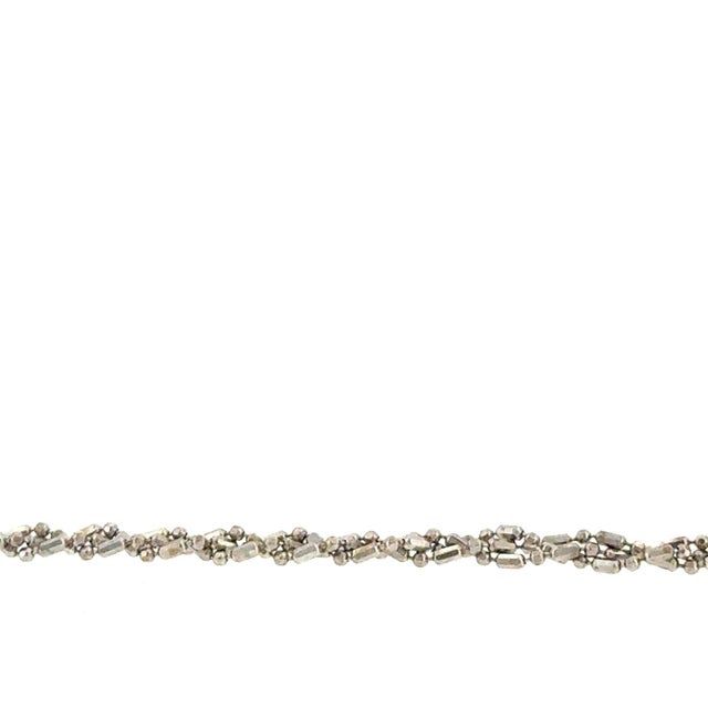 18K White Gold Diamond-Cut Bead and Bar Link Bracelet This elegant 18K white gold bracelet features a sophisticated...