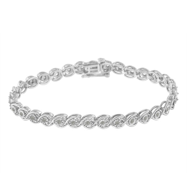 Elegant and timeless, this gorgeous sterling silver link bracelet features 0.5 carat total weight of round, rose cut,...