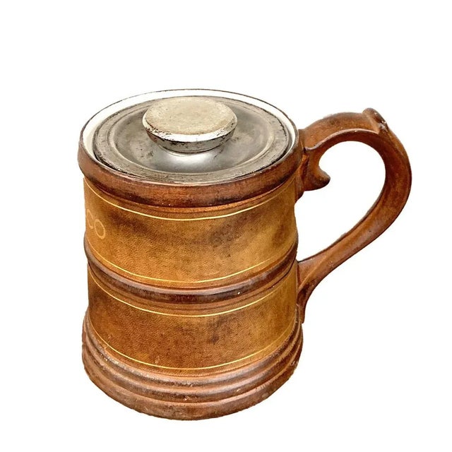 Fantastic Mid-Century leather and porcelain ceramic tobacco pot with gold finishes. This amazing piece was produced in...