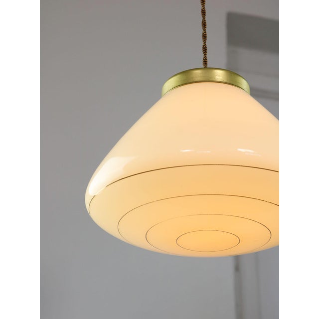Lamp's cover is made of genuine brass material complementing this vintage item nicely with it's golden colour. total...