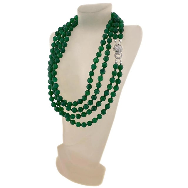 This is a green onyx necklace with a sterling silver leopard clasp. Nouveau Boutique created this double-strand long swing...