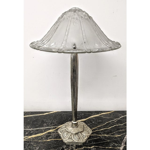French Art Deco table lamp Signed "Lorrain Nancy France". (signature in the last image) The shade is enhanced by a typical...