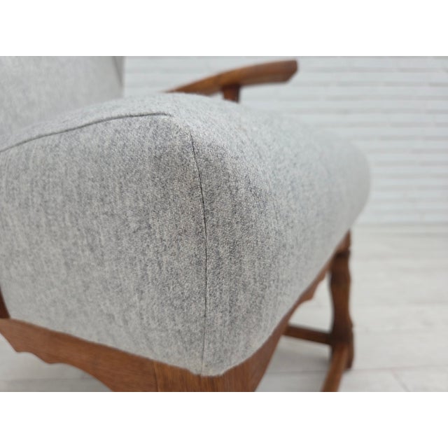 1950s, Danish high-backed armchair. Completely renovated-reupholstered in quality light gray furniture wool. Solid oak...