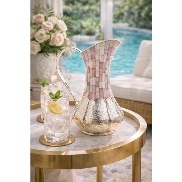 Striking and sculptural Mexican Modern pitcher designed and handcrafted in the 1960s by Los Castillo in Taxco, Mexico, one...