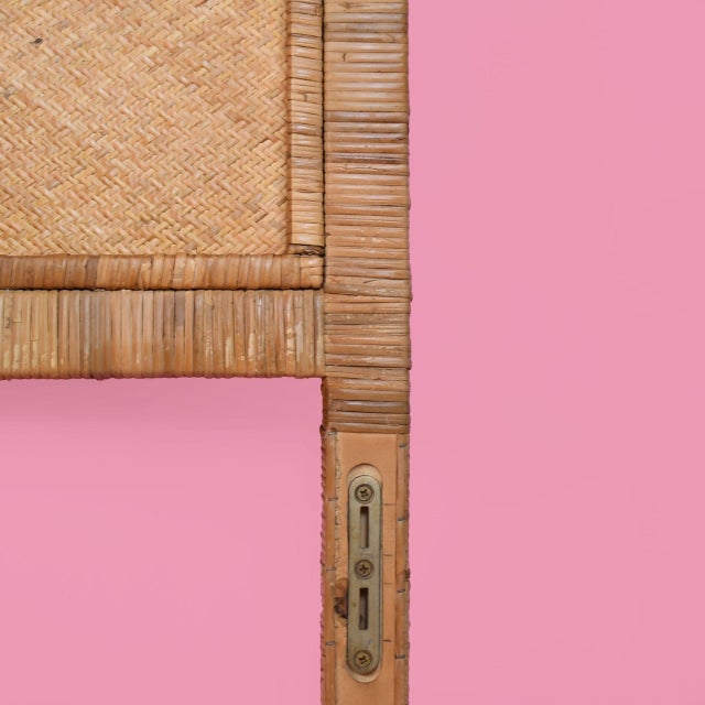 A queen headboard in wrapped and woven rattan, with a softly arched profile that brings instant island ease to the...