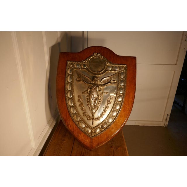 Large Arts and Crafts Shield Trophy with Nike the Goddess of Victory The is a very impressive Arts and Crafts piece, the...