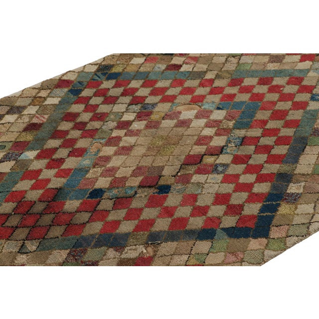 Handmade in wool and originating circa 1920-1930, this 3x5 rug is a rare and exciting new curation in Rug & Kilim’s...