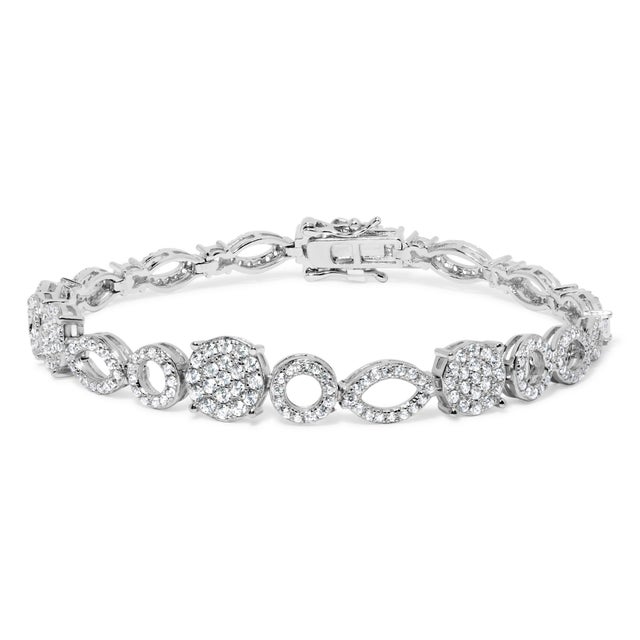Crafted in gleaming 10K white gold, this exquisite bracelet is a symphony of 274 natural diamonds, totaling a dazzling...