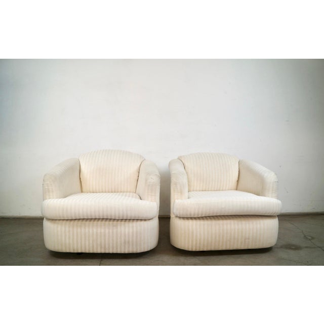 Pair of 1970's lounge chairs for sale. These are from the late 1970's, and are well built. They have a swivel base, and...