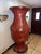 Impressive oversized Chinese red lacquer papier-mâché floor vase with matching carved stand. Beautifully hand-painted with...