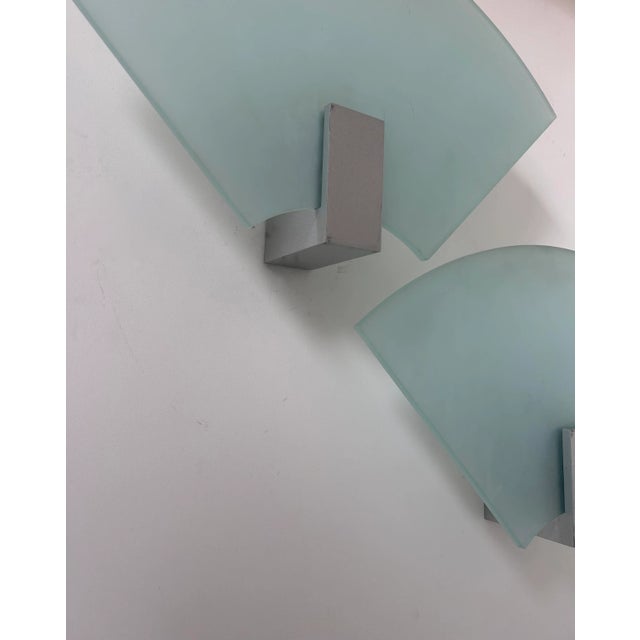 Very large pair of fan-shaped wall lights produced in Italy in the 1980s. Thick sandblasted glass slab (1cm) supported by...