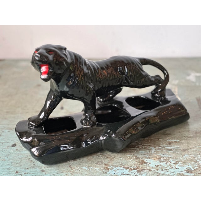 Strong Black Panther on a log, growls with red eyes and open red mouth - in the form of a ceramic planter with three...