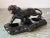 Strong Black Panther on a log, growls with red eyes and open red mouth - in the form of a ceramic planter with three...
