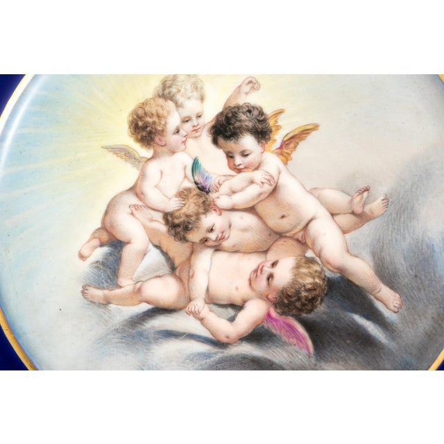 An exquisite pair of antique German porcelain cabinet plates hand-painted at the prestigious studio of Franz Xaver...