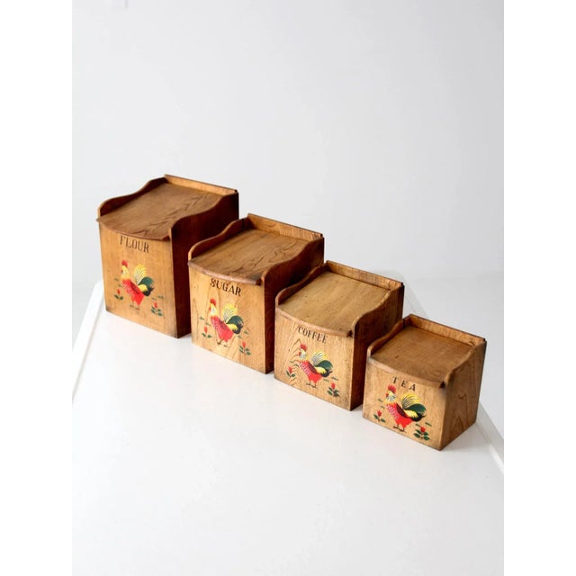 1950s rooster kitchen canister set with charming hand-painted details. Each wooden canister features a classic rooster...