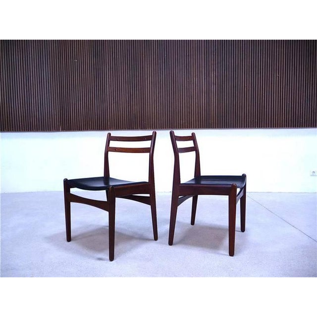 This nice set of six dining chairs was made by Frem Røjle in Denmark during the 1960s. They are made from dark solid teak,...