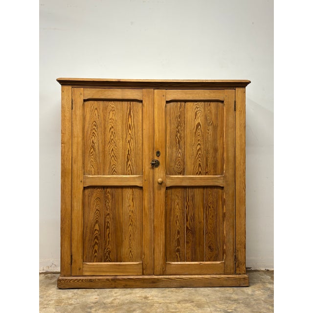 This 19th century English pitch pine cupboard carries the quiet confidence of true country craftsmanship. Pitch pine,...