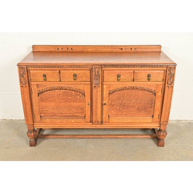 An exceptional English Jacobean style sideboard buffet, credenza, or bar cabinet In the manner of Berkey & Gay USA, Circa...