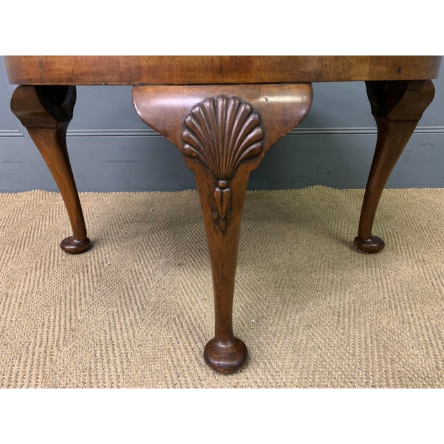 A lovely round coffee table in the Queen Anne style. Of generous proportions and of good construction in solid walnut with...