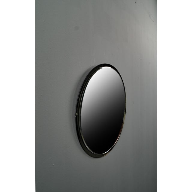 The mirror consists of two mirrors, the back one is made of smoked glass, the front one is made of normal glass. Both...