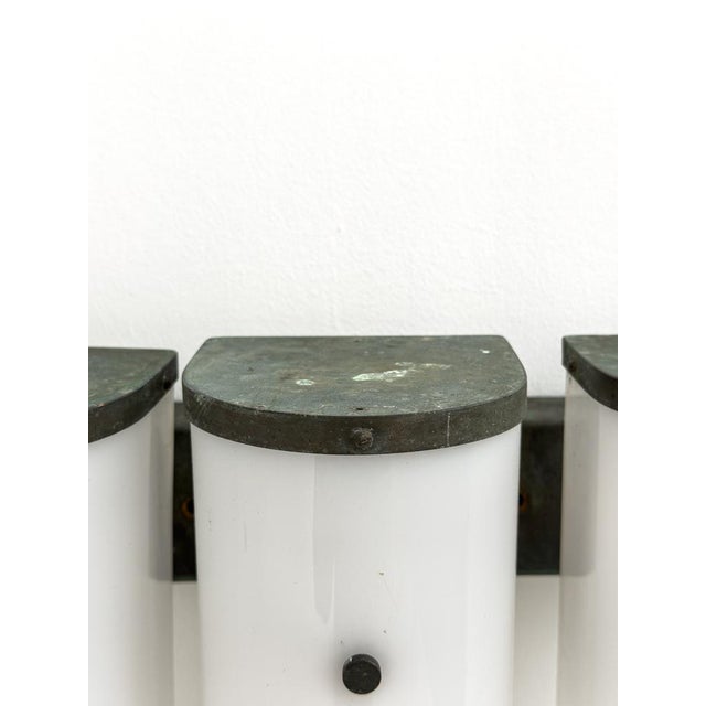 Attributed to Ateljé Lyktan, this sculptural Swedish Modern outdoor wall lamp was produced in Sweden during the 1950s....