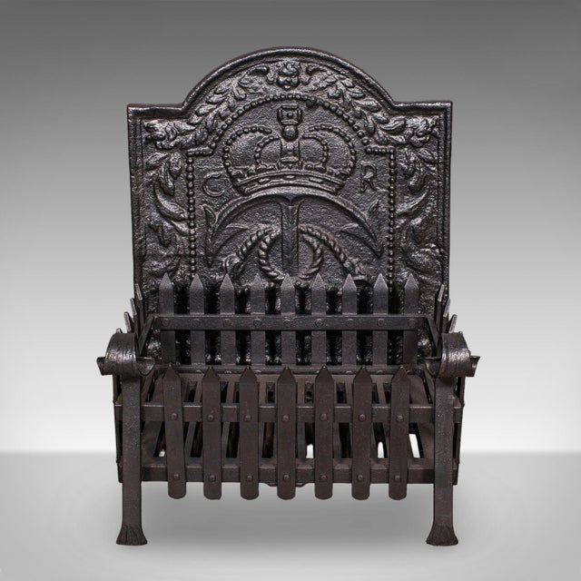 This is an antique fireplace hearth set. An English, cast iron fire back and grate duo, dating to the late Victorian...